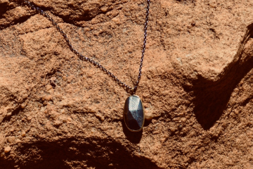 Carved stone pendant